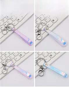 Detail of holographic laser PVC keychains in four color variations with lobster clasps