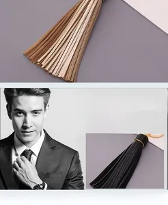 Close-up of handmade braided leather tassel keychain with durable metal ring and luxury texture