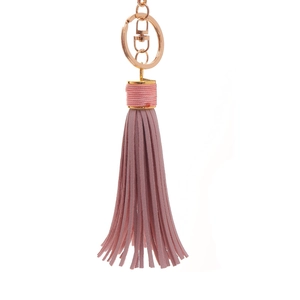 Close-up of pink leather tassel keychain with light gold metal lobster clasp and ring