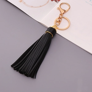 Minimalist black leather tassel keychain with elegant gold plated lobster clasp for bags
