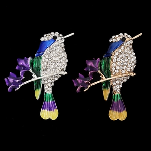 Detailed pair of hummingbird pins with sparkling rhinestones and colorful enamel on branches
