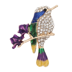 Exquisite hummingbird brooch with colorful enamel wings and sparkling white crystals