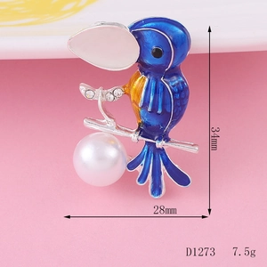 Creatieve vogel hanger van legering met blauw emaille, strass en een grote witte parel erop