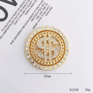 Sparkling gold 62mm dollar sign accessory with white rhinestones and braided chain detail