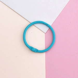Macro shot of bright blue lacquered loose-leaf ring binder with mechanical locking