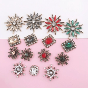 Macro shot of vintage style jewel charms with rhinestones and pearls for DIY phone cases