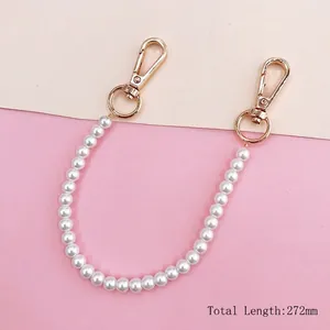 DIY pearl phone strap with golden lobster clasps and rings for stylish accessory