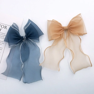 Elegant mermaid lace bow hair clip with long ribbons in champagne and navy blue