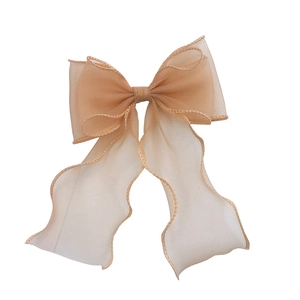 Large apricot mermaid lace bow hair accessory with translucent mesh ribbons for women