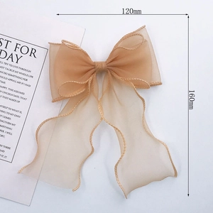 Champagne organza lace bow hair clip with long ribbons and elegant 160mm trailing streamers