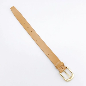 Detailed macro view of the light brown leather wrist strap with a gold metal buckle closure