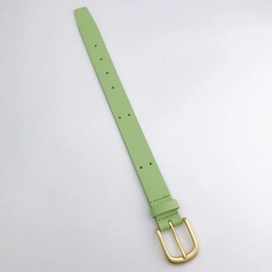 Detail of light green slim leather phone strap featuring a matte gold pin buckle