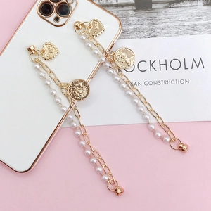 Retro phone case chain with gold pearls, heart pendant, and vintage portrait coin charm
