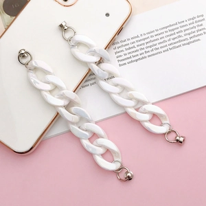 Close-up of pearl white acrylic phone case chains with metallic silver rings set