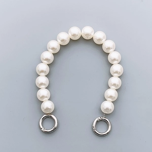 Chic handheld phone case chain featuring large white faux pearls and silver spring clasps