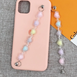 Pink silicone phone case featuring two macaron gradient acrylic heart beaded chains