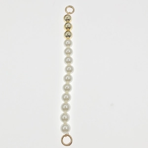 Detail of white pearls and gold beads chain with spring rings for DIY jewelry craft