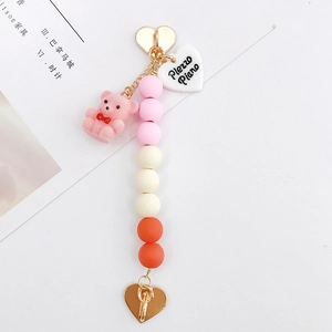 Pink flocked bear keychain with gradient acrylic beads and golden heart-shaped clasp