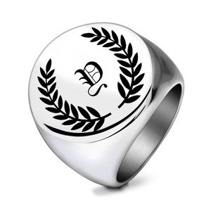 Detail showing laser engraved Gothic letter P and laurel wreath on a 22MM signet ring