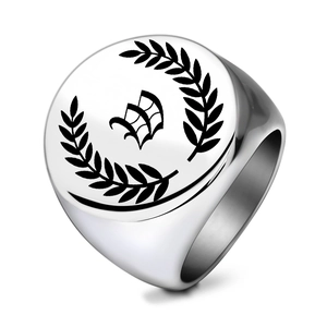 Macro shot of 22mm signet ring featuring laser-engraved laurel leaf and gothic letter