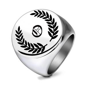 Macro shot of polished stainless steel signet ring with engraved laurel leaf design
