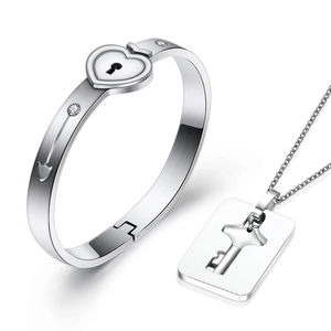 Polished stainless steel couple's jewelry set with heart lock bracelet and key necklace
