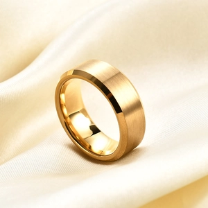 Macro shot of 8mm gold tungsten ring with brushed texture finish and polished beveled edges