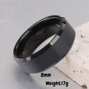 Detail of 8mm black stainless steel ring with brushed matte finish and polished beveled edge