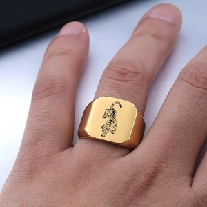 Mens square 18mm punk tiger signet ring in gold-plated stainless steel on finger