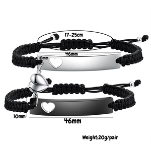 Detail view of magnetic heart couple bracelets with size specs and adjustable black cord