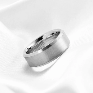 Detail view of tungsten carbide ring with brushed finish and polished beveled edges