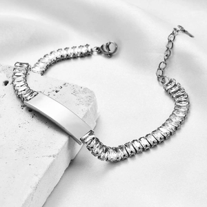 Detail of 9mm stainless steel bracelet with zircon inlay and custom engraving plate