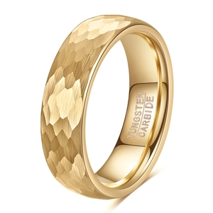 Detailed macro view of 6mm gold tungsten ring with hammered texture and inner engraving
