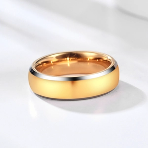 Close-up of dual-tone stainless steel ring with polished rose gold and silver finish