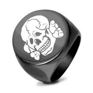 Macro shot of 22mm black titanium steel signet ring featuring a white skull and crossbones icon