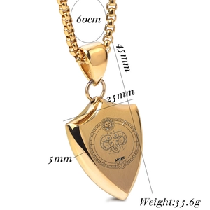 Detailed view of 18K gold shield pendant with Aries constellation engraving and dimensions