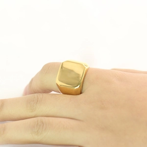 Polished 18mm square gold signet ring worn on index finger with mirror finish texture