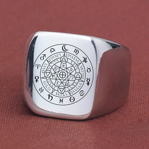 Macro view of a 18mm square signet ring featuring detailed etched zodiac symbols