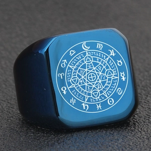 Macro detail of a square blue signet ring featuring laser-engraved zodiac and mystical symbols