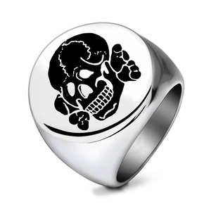 Punk style stainless steel ring featuring a round flat face with a black skull and crossbones