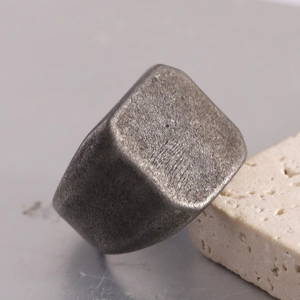 Vintage oxidized stainless steel signet ring with a textured flat rectangular surface
