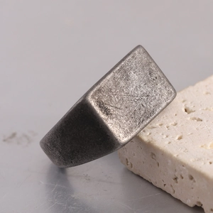 Macro detail of vintage rectangle ring with distressed antique silver finish on stone