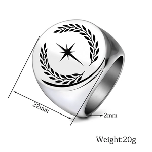 Macro view of 22mm silver signet ring with engraved star and laurel wreath pattern