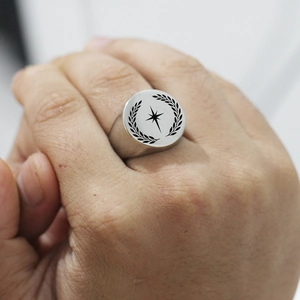 Men's 22mm stainless steel signet ring with engraved star and laurel wreath design