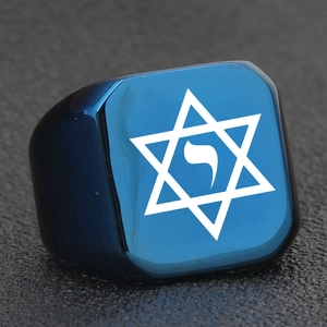 Detail of blue stainless steel signet ring with engraved Star of David and Hebrew symbol