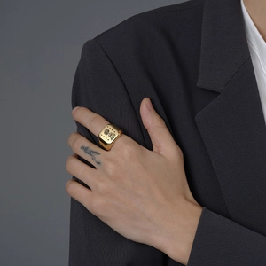 Polished 18mm gold stainless steel signet ring with engraved tree and stars design
