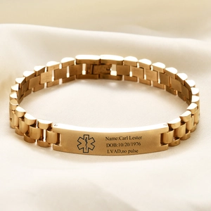 Macro detail of gold stainless steel medical alert bracelet with custom engraving