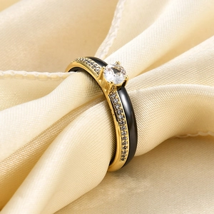 Macro shot of 4mm black ceramic ring with micro-pave diamonds and central zircon stone