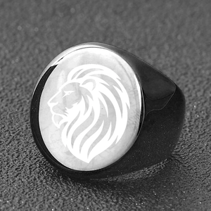 Macro shot of lion head engraving on vintage stainless steel signet ring band