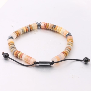 Detail of adjustable woven bracelet with natural tiger eye and obsidian abacus beads